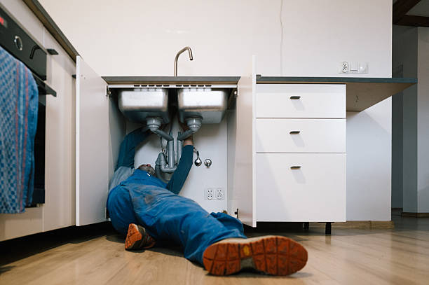 Professional Emergency Plumber technician working in Perryopolis, PA